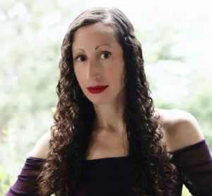 profile photo of a woman with long curly hair