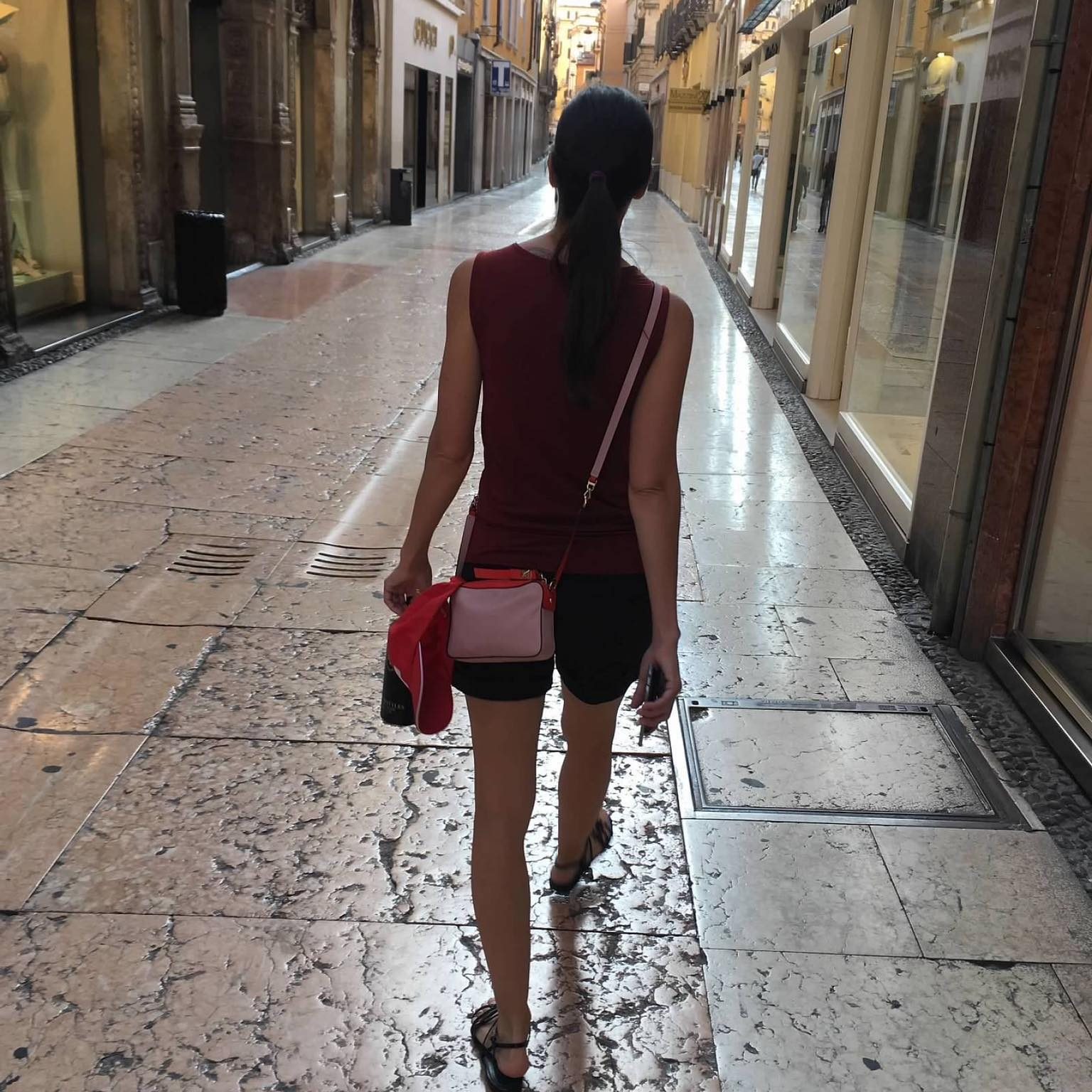 profile photo of a woman walking down a street